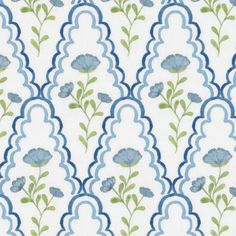 a blue and white wallpaper with flowers on it