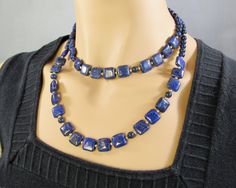 "Uniquely cut square \"pillows\" of vibrant blue lapis lazuli spaced with 14K gold filled beads create this beautiful adjustable length necklace. Two sizes are available, each with a 2 inch gold filled chain so every woman can get their best fit. The 12 mm squares are large enough to showcase the beauty of the natural stone, yet small enough for an everyday fashion accessory. Choose from 16 to 18 inch and 20 to 22 inch, that's 41-46 cm or 51-56 cm for my non-US visitors. Or send me a message to Blue Beaded Rectangular Jewelry, Blue Rectangular Beaded Jewelry, Blue Lapis Lazuli Rectangular Jewelry, Blue Rectangular Jewelry With Natural Stones, Blue Rectangular Natural Stones Jewelry, Blue Rectangular Natural Stone Jewelry, Nice Necklaces, Square Pillows, 9th Anniversary