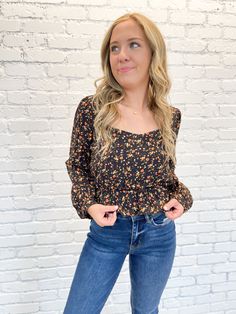 Make a statement with this one-of-a-kind floral top! Crafted with exquisite detail, its square neckline, elastic peplum waist, and cropped design combine to create an eye-catching chic look. Pair it with denim for a playful look, or dress it up with a high waisted skirt – either way, you'll be sure to turn heads! Square neckline Elastic peplum waist Cropped fit Chic Cropped Smocked Top For Fall, Chic Fitted Floral Print Smocked Top, Fitted Cropped Smocked Top For Fall, Chic Floral Print Crop Top For Fall, Trendy Fitted Peplum Top For Brunch, Trendy Square Neck Crop Top For Spring, Casual Fall Crop Top With Square Neck, Casual Fitted Floral Print Peplum Top, Fitted Floral Print Cropped Smocked Top