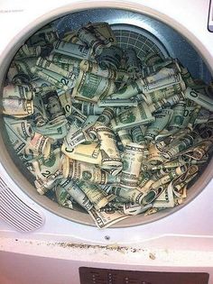 a washing machine filled with lots of money