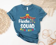 Fiesta Squad Shirt, Mexican Fiesta Party, Fiesta Bachelorette, Mexican Fiesta Shirt, Let's Fiesta Shirt, Sombrero Shirt, Cinco De Mayo Shirt ----- How To Order ----- 1-) Please, check and review all the photos. 2-) Choose your t-shirt size and color. *Different styles of shirts may have different shades of same color choice due to different manufacturer brands. *For this reason, we recommend you to match shirts from the same styles if you want precisely matching colors (ex. Unisex, V-necks, Todd Fiesta Shirts Women, Fiesta Squad Shirts, Final Fiesta Shirts, Mexican Theme Party Decorations, Fiesta Shirt, Cinco De Mayo Graphic Cotton T-shirt, Mexican Fiesta Party, Mexican Theme, Mexican Party Theme