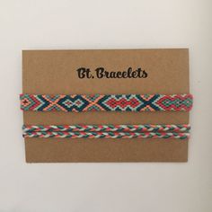 three braided bracelets with different colors and designs on brown cardboard card, against white background