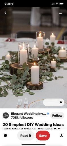 the table is set with candles and greenery