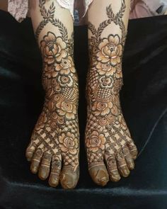 the feet are decorated with henna and flowers