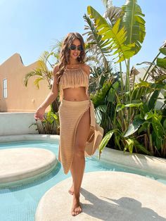 Style: Fishnet Beach Cover-Up SkirtItem Type: Beach Skirts, Beach Cover-Ups, Bikini Cover-Up Skirts, SwimwearLength: MidClosure Type: PulloverDetail: Lace-Up Bow, Sheer, AsymmetricalMaterial: CottonPattern Type: Solid