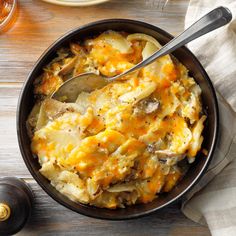 a bowl filled with food and a spoon