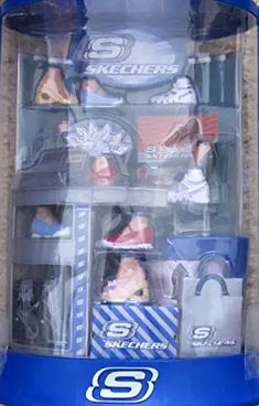 a display case with several different sports memorabilias in it's plastic packaging box