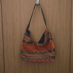 New Condition With Tag Attached. Casual Brown Fabric Shoulder Bag, Casual Brown Fabric Bag, Casual Orange Hobo Shoulder Bag, Casual Orange Shoulder Bag For Daily Use, Orange Hobo Bag With Adjustable Strap For Daily Use, Orange Bag With Adjustable Strap For Fall, Orange Fall Bag With Adjustable Strap, Casual Orange Rectangular Hobo Bag, Casual Orange Hobo Bag For Daily Use