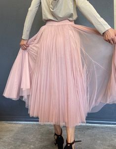 pink tulle skirt wedding party vocation skirt size M  Details :  Color: pink Size: M  Elastic waist  Material: Tulle lining inside  Measurements: *Waist: 12 inches across lay flat ( 24 inches around); can stretch to 19 inches wide (38 inches around). *Skirt length: 32 inches long Weight:  Appropriate 1 lb 5oz Care: Hand wash/Dry clean * Model's height is 5'7'' and waist is 28 inches, and is wearing size M  ---------------------------------------- Spring Wedding Tulle Fabric With Ruffled Skirt, Tulle Pleated Skirt For Summer, Fitted Pink Tulle Bottoms, Pink Full Skirt Bottoms For Wedding, Summer Pleated Tulle Skirt, Spring Party Tulle Fabric With Lined Skirt, Pink Summer Wedding Bottoms, Pleated Tulle Party Bottoms, Spring Party Pleated Tulle Skirt