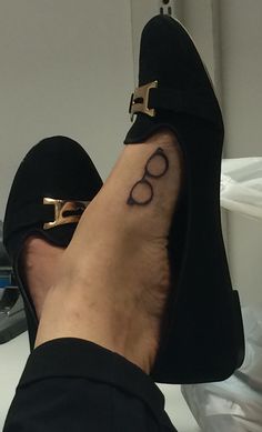 a person's foot with a tattoo on it