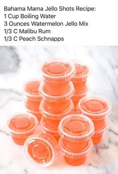 there are many orange cups in the middle of this photo, and one is filled with watermelon jello mix