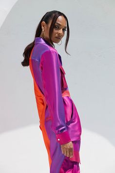 Orange & purple jumpsuit with vertical slit color Graydient  Luxe Heavy stretch satin  Hidden button front closures  Cargo pockets on chest & legs  Detachable belt Future Dusk, Purple Jumpsuit, Orange Pink Color, Clubbing Outfits, Glam Outfit, Orange Outfit, Purple Outfits, Dope Outfits, Stretch Satin