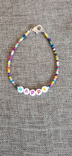 Rainbow beaded happy inspiration bracelet. 7.5 inches Funky Beaded Bracelets, Trendy Bracelet Ideas, Trendy Colorful Beads Beaded Bracelet For Birthday, Trendy Colorful Beads Bracelet For Birthday, Bohemian Beaded Bracelets With Round Beads For Birthday, Trendy Colorful Beaded Bracelets For Birthday, Trendy Colorful Beaded Bracelet For Birthday, Bohemian Beaded Bracelets For Birthday, Cheerful Handmade Adjustable Beaded Bracelets