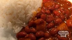 a white plate topped with rice and beans