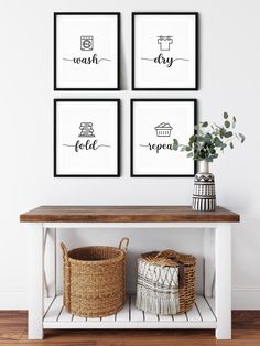 three black and white prints hanging on the wall above a wooden table with wicker baskets