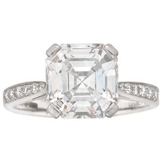 A single stone diamond ring, the square emerald-cut diamond weighing 3.07 carats, of E colour VS1 clarity, GIA certificate, four claw-set to a scroll pierced collet, with ribbed shank and round brilliant-cut diamond-set tapered shoulders, stamped PT900 307, hallmarked London 2009, platinum 900, gross weight 4.15 grams This magnificent diamond ring comes from the collection of Bentley & Skinner, the London jewellers by appointment to both Her Majesty the Queen and His Royal Highness the Prince of Single Stone Diamond Ring, Square Cut Ring, Square Cut Rings, Gia Certificate, Emerald Cut Diamond Ring, Stone Diamond Ring, Her Majesty The Queen, Stunning Engagement Ring, Single Stone