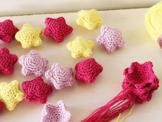 crocheted flowers and yarn on a table