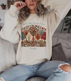 Celebrate the season of cozy sweaters and vibrant colors with our "Fall is My Favorite Color" fleece-lined sweatshirt. This delightful piece captures the magic of autumn with a stunning folk art style design of fall trees in all their glorious hues. Perfect for friends, family, and nature lovers, this sweatshirt adds a personalized touch that makes it truly unique. Wrap yourself in warmth and style, and let the rich reds, oranges, and yellows of fall brighten your wardrobe. Whether you're enjoyi Fall Letter Print Multicolor Sweatshirt, Multicolor Crew Neck Sweatshirt For Fall, Multicolor Graphic Print Fall Sweatshirt, Fall Is My Favorite Color, Family Nature, Fall Trees, Changing Leaves, Leaves Fall, My Favorite Color