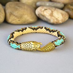 Wonderful turquoise beaded snake bracelet will be a great gifts for women.This bracelets is made of highest quality Japanese Toho beads.Diameter 0.3 inch. (0.7 cm).IMPORTANT:When choosing the length of the bracelet, keep in mind that the bracelet should be about 1 inch longer than your wrist.Bracelet is 100 % handmade.This bracelet will be shipped within 35 business days.I carefully pack all items and ship them with registered Air Mail with tracking number.Piece of my soul, which I left in this Ouroboros Jewelry, Serpent Bracelet, Beaded Snake, Handcrafted Gifts, Toho Beads, Seed Bead Bracelet, Snake Bracelet, Great Gifts For Women, Seed Bead Bracelets