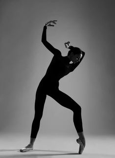 a woman is standing in the middle of a dance pose