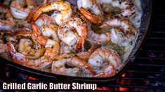 grilled garlic butter shrimp in a skillet over an open fire with the words grilled garlic butter shrimp on it