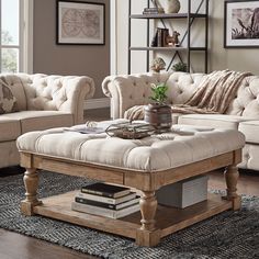 a living room with two couches, a coffee table and a rug on the floor