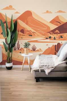 a living room with a couch, chair and wall mural