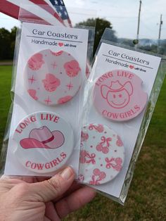 two pink and white buttons with the words long live cowgirls on them