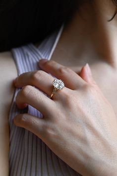 a close up of a person wearing a ring