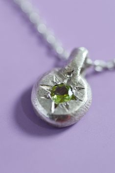 The delicate Fay Peridot pendant is the perfect way to add a touch of elegance to your everyday look. Crafted with Sterling Silver and a star-set Peridot, perfect for adding a bit of mystical charm. Use the drop down to select your chain preference. Details925 Sterling SilverRound cut PeridotHandcrafted in our studioEach piece is handmade so please allow for minor differences in texture and colour.Item #9904-01 Mixed Metal Pendants, Silver Aesthetic Jewelry, Silver Clay Jewelry, Silver Neckalce, Stone Settings Jewelry, Styled Jewelry, Soldered Pendants, Silver Clay, Silver Necklace Pendant