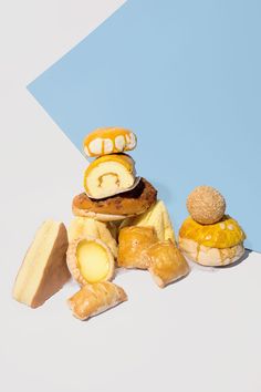 some food is stacked on top of each other in front of a blue and white background