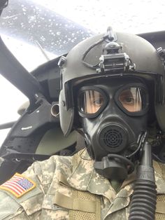 a soldier wearing a gas mask and goggles