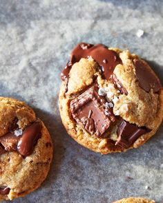 two chocolate chip cookies with one broken in half