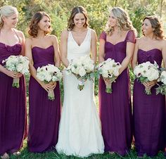 bridesmaids in purple dresses posing for pictures