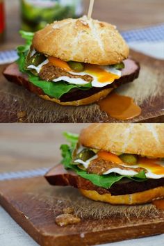 two sandwiches with meat, cheese and lettuce