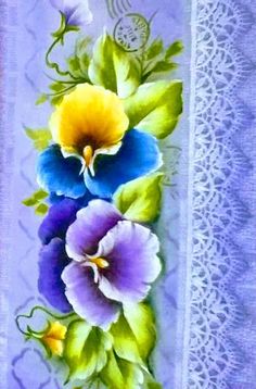 an image of flowers painted on the side of a table cloth with laces and crocheted doily