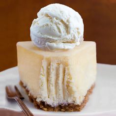 a piece of cheesecake with ice cream on top