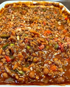 a casserole dish filled with meat and vegetables