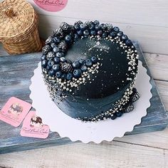 there is a cake with blueberries on it