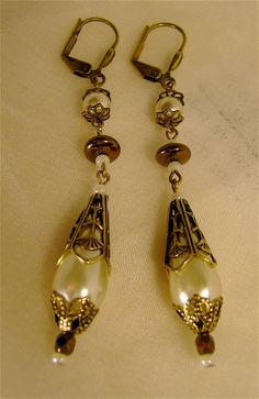 Olivous Retro's neo-victorian drop earrings. Made from new vintage glass pearls & beads with patina solid brass findings & eurowires. They are delicate & ornate, about 2.5" in length from the top of the earwire, 8mm pearl teardrop bead.  If reasonably cared for these pieces can last for many year... Vintage Handmade Jewelry, Metal Teardrop Clip-on Earrings With Pearl Drop, Elegant Beaded Clip-on Earrings For Formal Occasions, Vintage Metal Chandelier Earrings With Dangling Beads, Antique Teardrop Jewelry In Antique Gold, Elegant Beaded Dangle Clip-on Earrings, Elegant Beaded Copper Jewelry, Elegant Copper Earrings With Dangling Beads, Elegant Beaded Bronze Jewelry