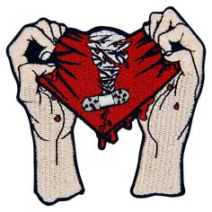 two hands holding up a red heart