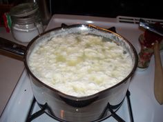 a large pot filled with food sitting on top of a stove