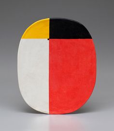 a black, white, yellow and red plate on a gray background