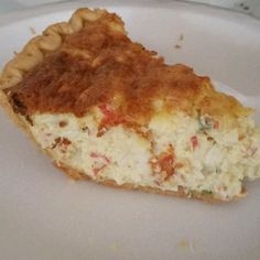 a piece of quiche on a white plate