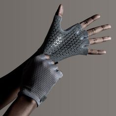 a person's hand wearing a glove with perfored design on the palm