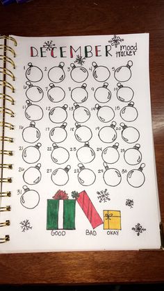 an open notebook with christmas themed writing on it