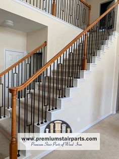 an empty staircase in a house with white walls