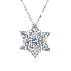 This stunning pendant is exquisitely handcrafted in pure silver, revealing a sophisticated snowflake design. It is framed with delicate blue stones and sparkles brightly like a fallen snow, bringing energy and happiness to your life. Suitable for ladies’ everyday wear and would make a lovely gift on any special occasio Elegant Festive Jewelry For Winter, Elegant Christmas Snowflake Necklace, Elegant Snowflake Jewelry For Festive Occasion, Elegant Winter Jewelry As Gift, Sterling Silver Snowflake Jewelry For Anniversary, Sterling Silver Snowflake Jewelry, Elegant Jewelry For Anniversary In Winter, Silver Snowflake Necklace Elegant Style, White Gold Snowflake Jewelry For Christmas