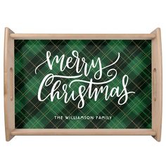 a green plaid christmas sign with the words merry christmas in white lettering on it's front