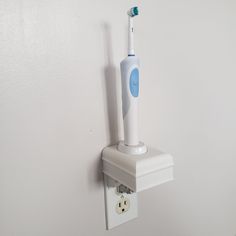 "Custom 3D printed electric toothbrush holder for a single Oral B charger.  Organize and hide your charger cord and free up valuable space.  Declutter your bathroom counter while still charging your toothbrush.  This toothbrush holder is mounted by replacing your existing outlet plate with a custom design and printed plate that is provided with your purchase.  This innovation looks sleek, clean and modern! Color:  White Product Dimensions: 3.25\" x 4\" x 6.25\" Base:  Oral B electric toothbrush Oral B Electric Toothbrush, Charger Organizer, Electric Toothbrush Holder, Mobile Home Decorating, Toothbrush Holders, Outlet Plates, Bathroom Counters, Bathroom Counter, Custom Plates